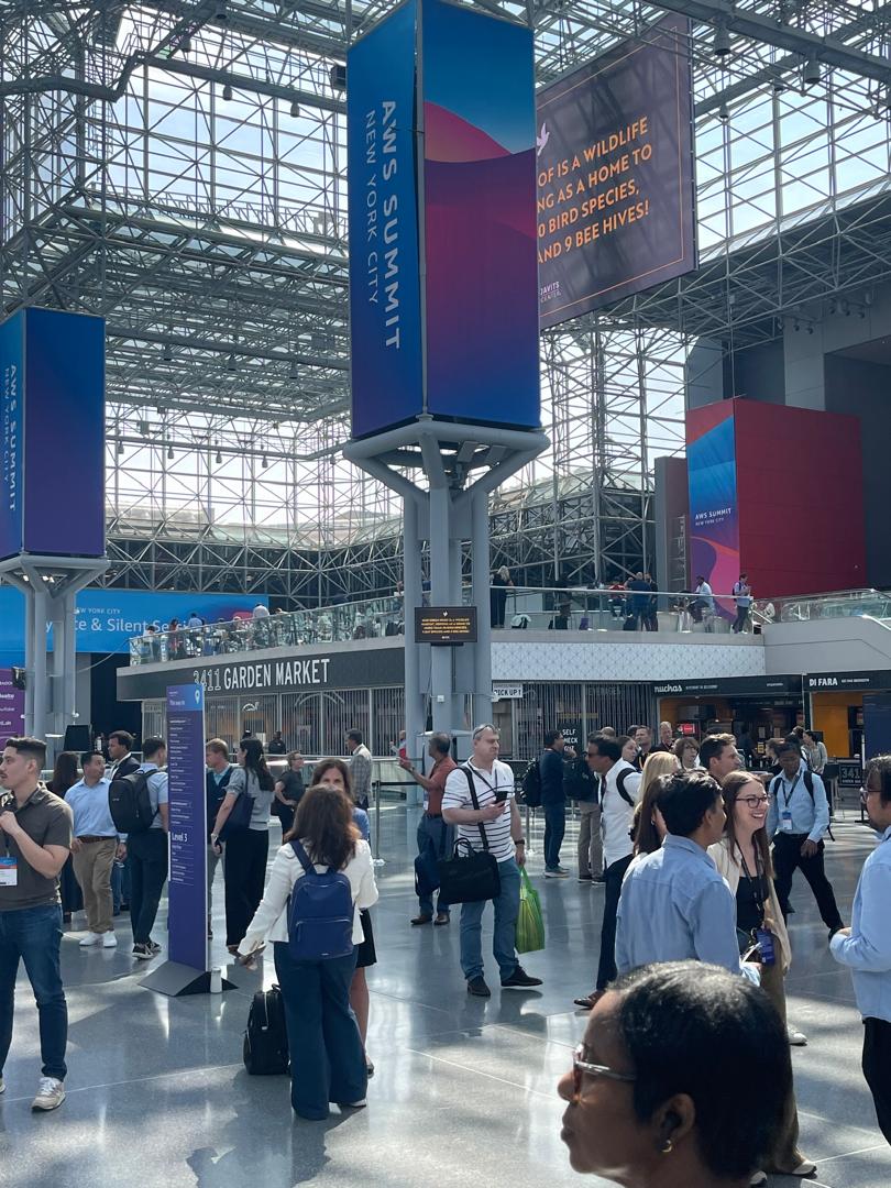 AWS Summit NYC venue - Javits Center main atrium with crowds and exhibitors