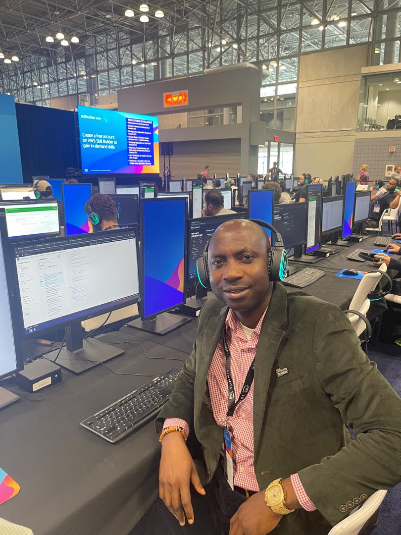 Felix at AWS Summit hands-on lab workstation with dual monitors